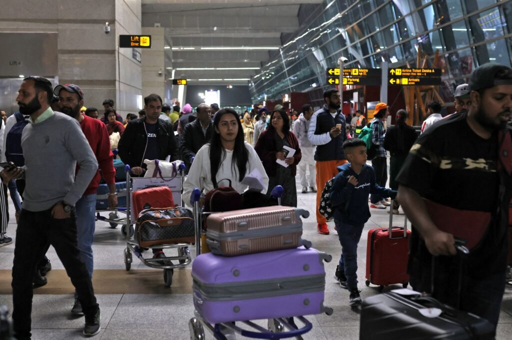 A passenger moving with luggage in an Airport Terminal