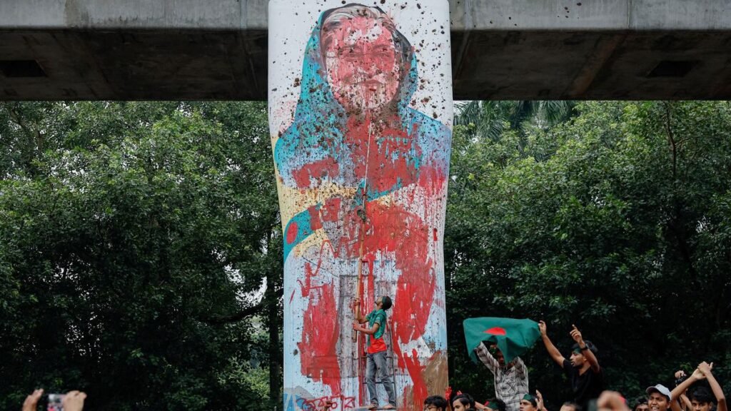 In this August 2024 picture, protesters shout slogans as they vandalise a mural of Bangladeshi Prime Minister Sheikh Hasina with paint and mud, demanding her resignation, at Teacher Student Center (TSC) area of University of Dhaka in Dhaka, Bangladesh. | Photo Credit: Reuters